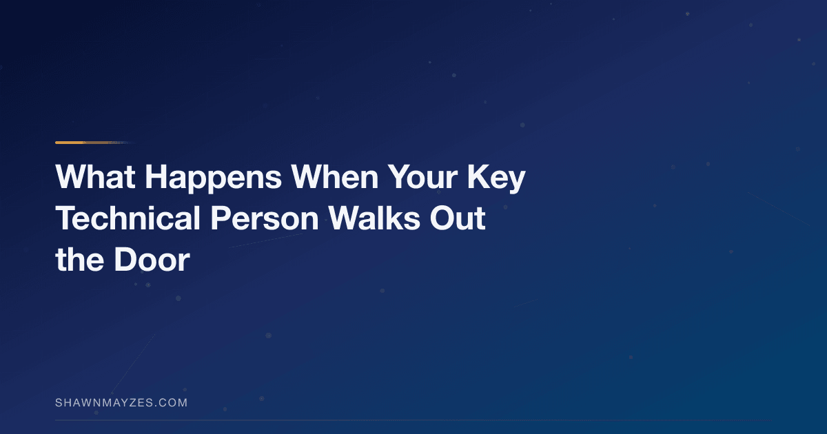 Empty desk with a computer in a startup office, representing key person risk